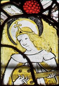 An angel playing a musical instrument, a detail from a fifteenth-century window at the All Saints' Church, Gresford.